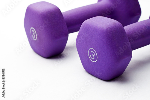 Photo: A pair of 3 lb purple neoprene weights beside each other A pair of 3 lb purple neoprene weights beside each other