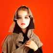 Halloween kid girl costume on orange