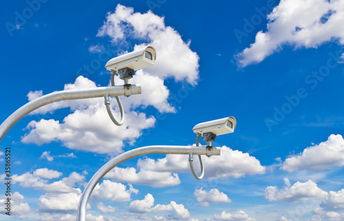 Photo: outdoor cctv cameras against blue sky outdoor cctv cameras against blue sky
