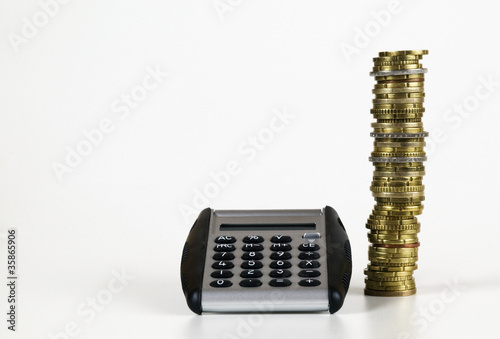 Foto: deck of EURO coins with calculator deck of EURO coins with calculator
