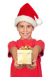 Adorable child with Santa Hat offering a gift