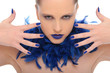 woman with blue fingernails and blue feathers