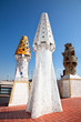 The mosaic chimneys made of broken ceramic tiles