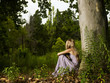 Beautiful young lady in the forest