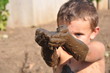 child and mud