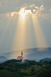 Sun rays shining down on a Church