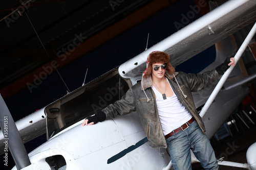 Photo: Young man with private airplane, a lifestyle image Young man with private airplane, a lifestyle image