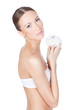 Young beautiful woman holding flower in her hands
