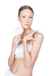 Young beautiful woman holding flower in her hands