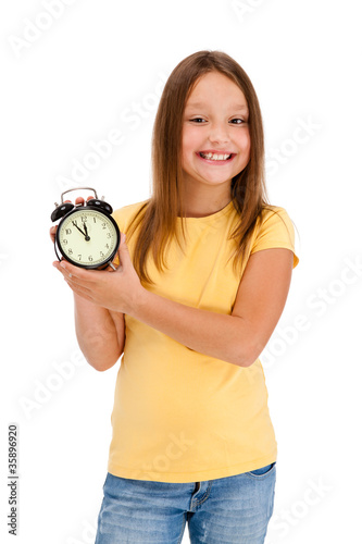 Photo: Girl holding alarm-clock isolated on white background Girl holding alarm-clock isolated on white background