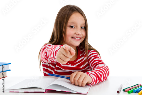 Photo: Girl learning isolated on white background Girl learning isolated on white background