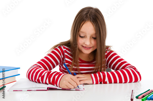 Photo: Girl learning isolated on white background Girl learning isolated on white background