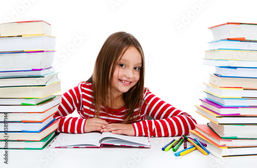 Photo: Girl learning isolated on white background Girl learning isolated on white background