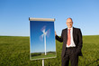 mann zeigt flipchart mit windrad
