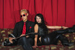 Cool couple sitting on red couch