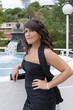 Photo: A young woman posing near a fountain A young woman posing near a fountain