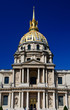 Invalides palace in Paris showing golden dome in blue sky Invalides palace in Paris showing golden dome in blue sky
