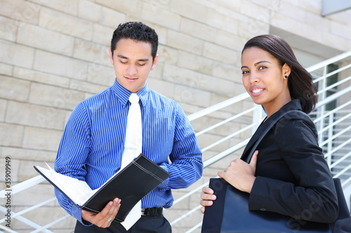 Photo: Diverse Business Team at Office Building Diverse Business Team at Office Building