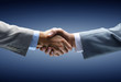 Handshake - Hand holding on black background