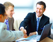 Business people shaking hands, finishing up a
