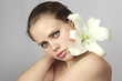 girl with a lily on a shoulder