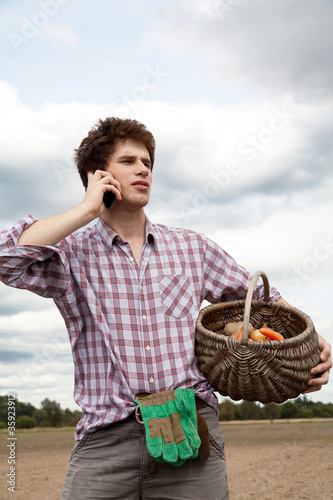 Photo: farmer speaking on the phone farmer speaking on the phone