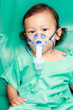 Photo: Baby and medical instrument on his face Baby and medical instrument on his face