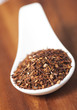 Spoon with loose Rooibos red tea, shallow focus Spoon with loose Rooibos red tea, shallow focus