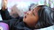 Little Girl Practices Reading Her New Book
