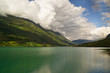 Clouds are reflected in water of the fjord Clouds are reflected in water of the fjord
