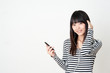 pretty asian woman listening music