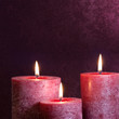 Candles on purple background