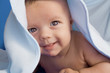 Little baby under a blue blanket