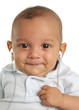 Musical baby boy listening to earbuds.