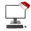 Foto: Cristmas online shopping concept - Computer with Santa hat Cristmas online shopping concept - Computer with Santa hat
