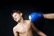 a child boxer in studio.