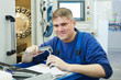 Foto: worker measuring detail worker measuring detail