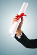 Diploma with a red ribbon