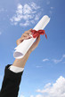 Diploma with a red ribbon.