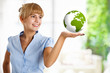 Beautiful woman holding the earth in her hand Beautiful woman holding the earth in her hand