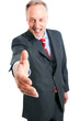 Mature businessman giving hand