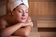 Woman relaxing in the sauna Woman relaxing in the sauna