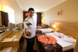 Photo: Cheerful bellboy ready for customers. Cheerful bellboy ready for customers.