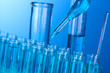 Test-tubes on blue background