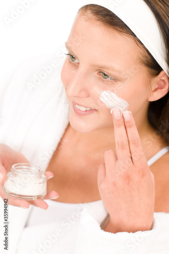 Photo: Acne facial care teenager woman apply cream Acne facial care teenager woman apply cream