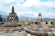 Stone Buddha and Borobudur Temple Stone Buddha and Borobudur Temple