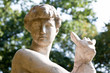 Naked young man sculpture in the park