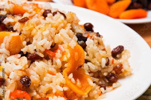 Photo: Pilaf made of rice, fresh carrots and dried fruits. Pilaf made of rice, fresh carrots and dried fruits.