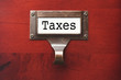 Lustrous Wooden Cabinet with Taxes File Label