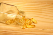 Capsules of fish oil spilled out